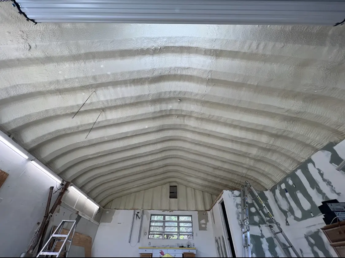 Spray polyurethane foam applied to the underside of a metal roof deck in Seabrook